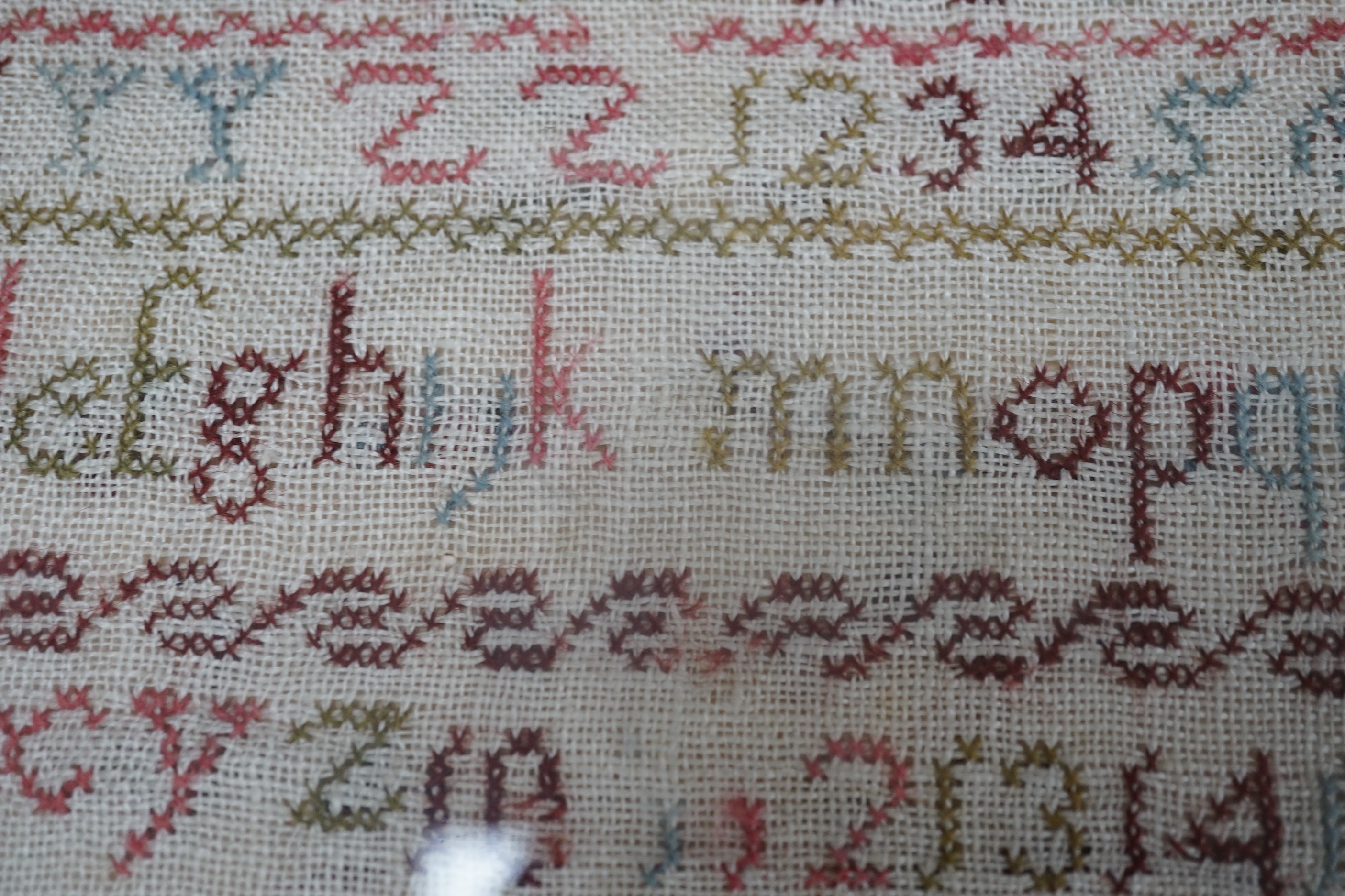 Two Victorian alphabet samplers worked by Emma and Hannah Barnes, one dated 1853, framed as one, overall 73 x 44cm